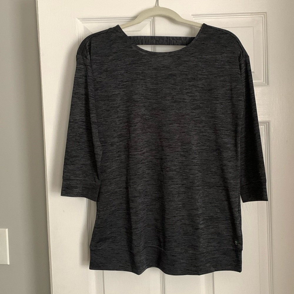 Izod work out shirt with criss cross detail in back. Size small